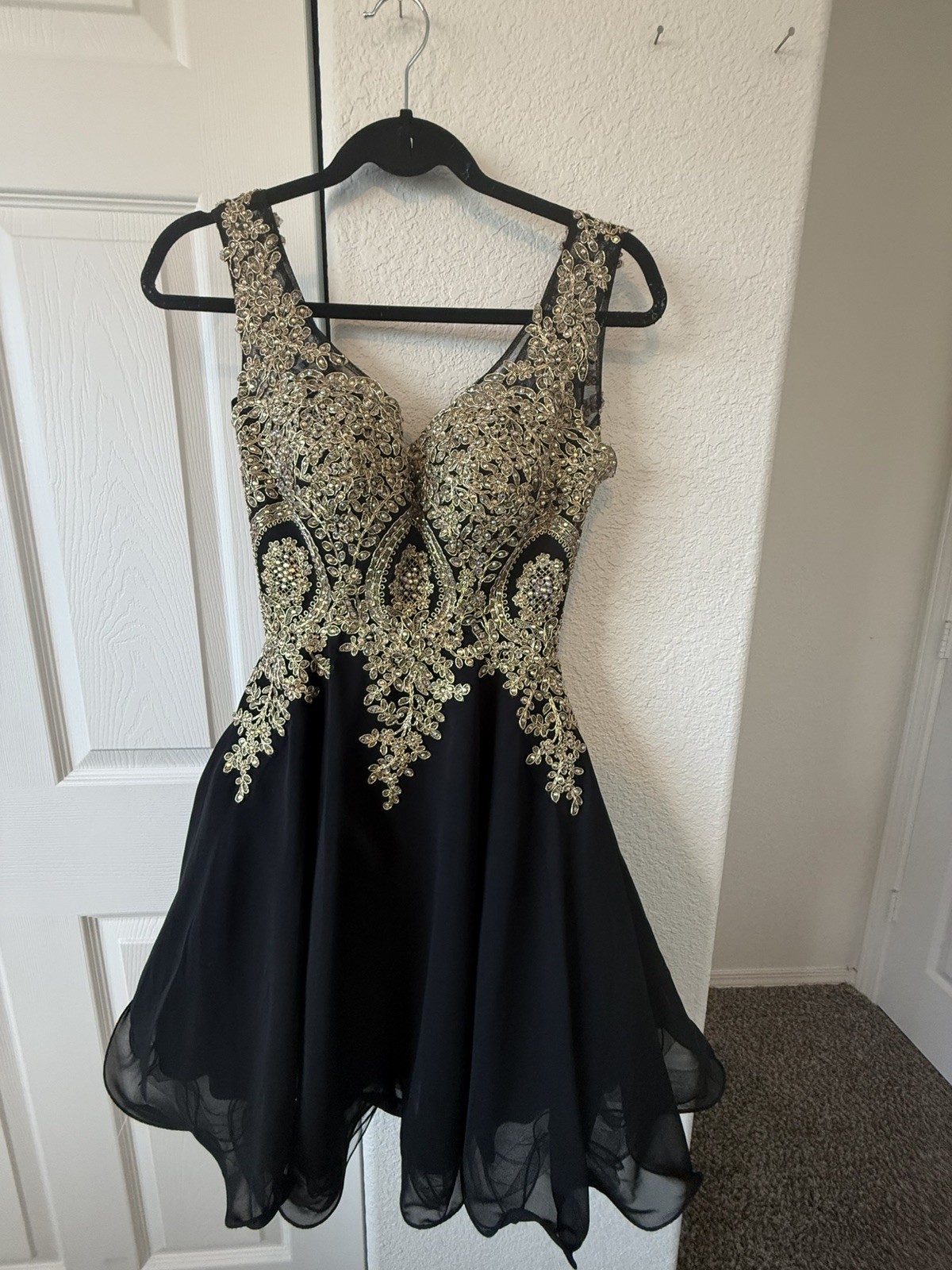 Elegant black and gold embroidered cocktail dress