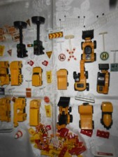 Quantity of toy construction vehicles plus accessories