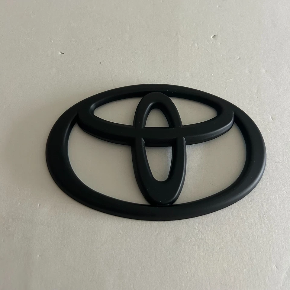 Parrilla delantera Toyota emblema logotipo negro Tacoma 2011 2012 2013 2014 2015 Foto 3 de 4