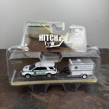 GREENLIGHT 2015 Ford Explorer NYC Parks Small Cargo Trailer HITCH & TOW 1:64 NEW