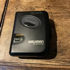Sony Walkman WM-EX102 Cassette Player Mega Bass AVLS FOR REPAIR-Turns On-No Spin