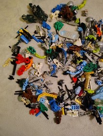LEGO Bionicle Lot - 2.9 lbs. Miscellaneous Parts and Manuals -8533, 8566, 8570