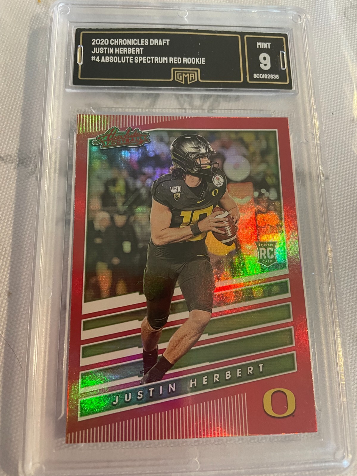 JUSTIN HERBERT CHARGERS 2020 CHRONICLES DRAFT ABSOLUTE SPECTRUM RED RC 4 GRADED9