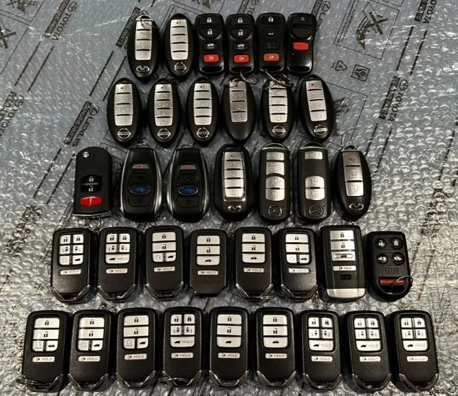 OEM-LOT OF 36 HONDA, NESSAN, , SUBARU, MAZDA, ACURA, INFINITI SMART REMOTES KEYS image 1