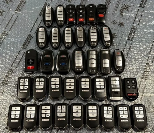 OEM-LOT OF 36 HONDA, NESSAN, , SUBARU, MAZDA, ACURA, INFINITI SMART REMOTES KEYS - product listing photo