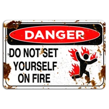 DANGER: Fiery Warning on Rustic Metal Sign