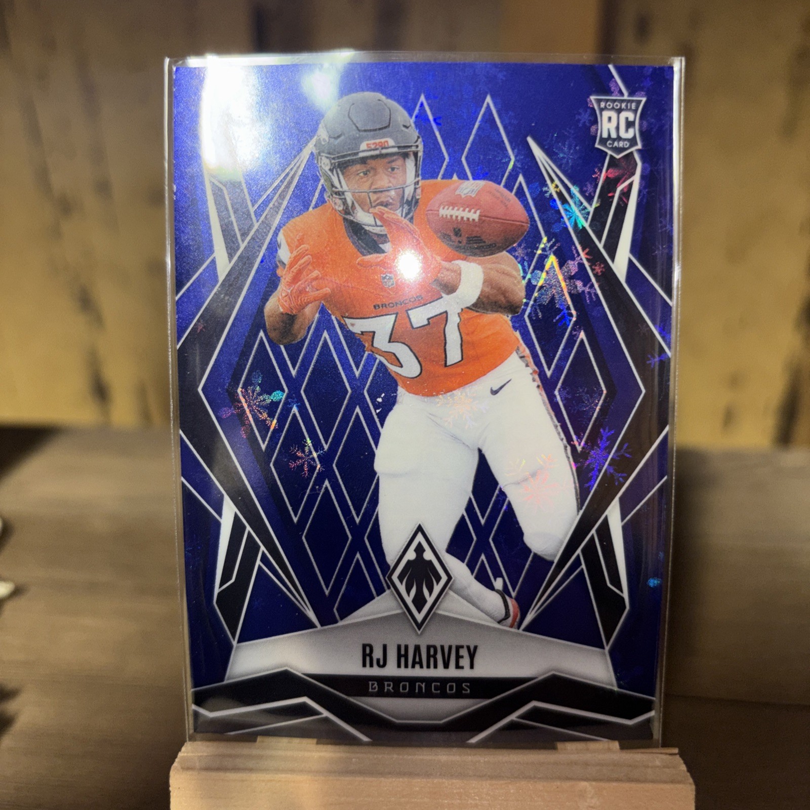 2025 Panini Phoenix - Rookies RJ Harvey #176 Blue Winter /199 (RC)
