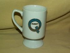 AMP MUG PEDESTAL IRISH COFFEE TEA CUP WE'RE QUALITY CONNECTED BLUE GOLD WHITE.
