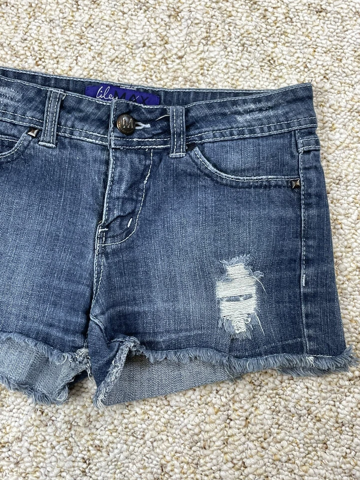 Pantalones Cortos Miley Cyrus Tiro Bajo Dobladillo Crudo Denim Elastizados Talla 7 (Cintura 28") Foto 4 de 4