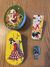 4 Vintage U.S. Metal Toys Tin Circus Clown Noisemaker Spinning Rattler Clicker