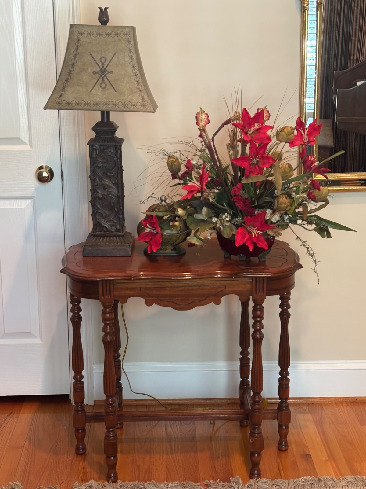 Vintage Victorian side parlor table with carved edges and turned legs