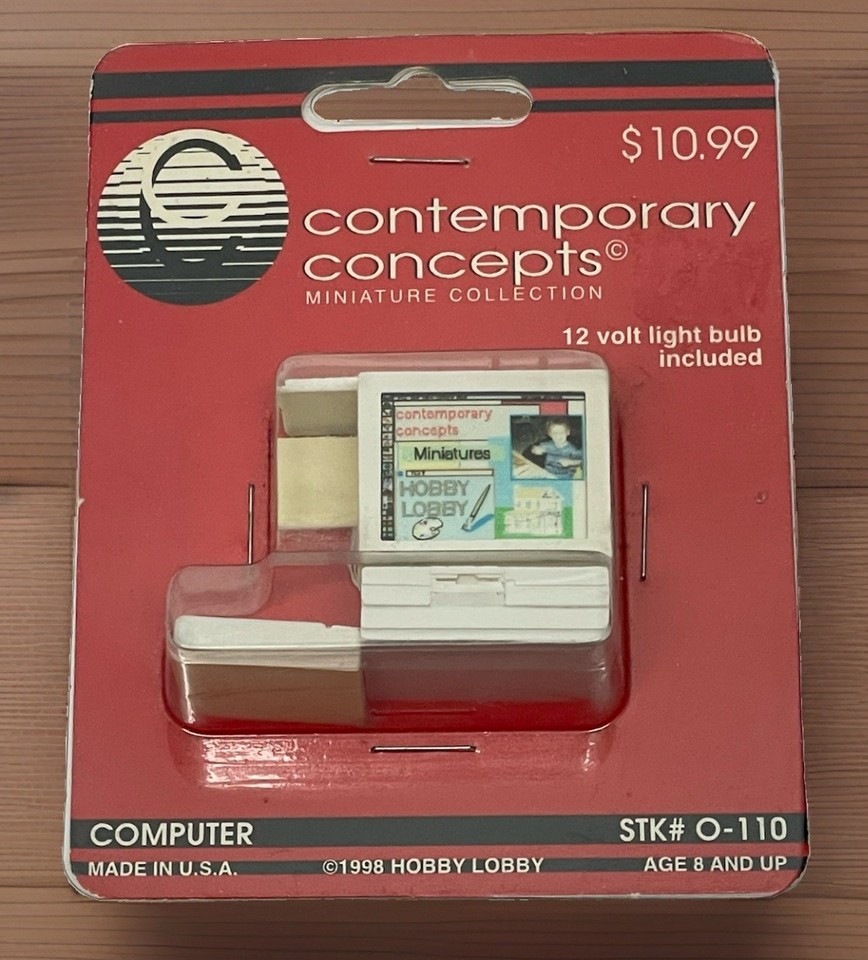 A tiny dollhouse-scale retro 90s PC miniature — a surprisingly charming collectible for anyone nostalgic for beige-box computing.