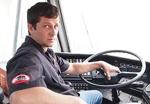 Ben McCloy behind the wheel of a 1976 airport crash truck