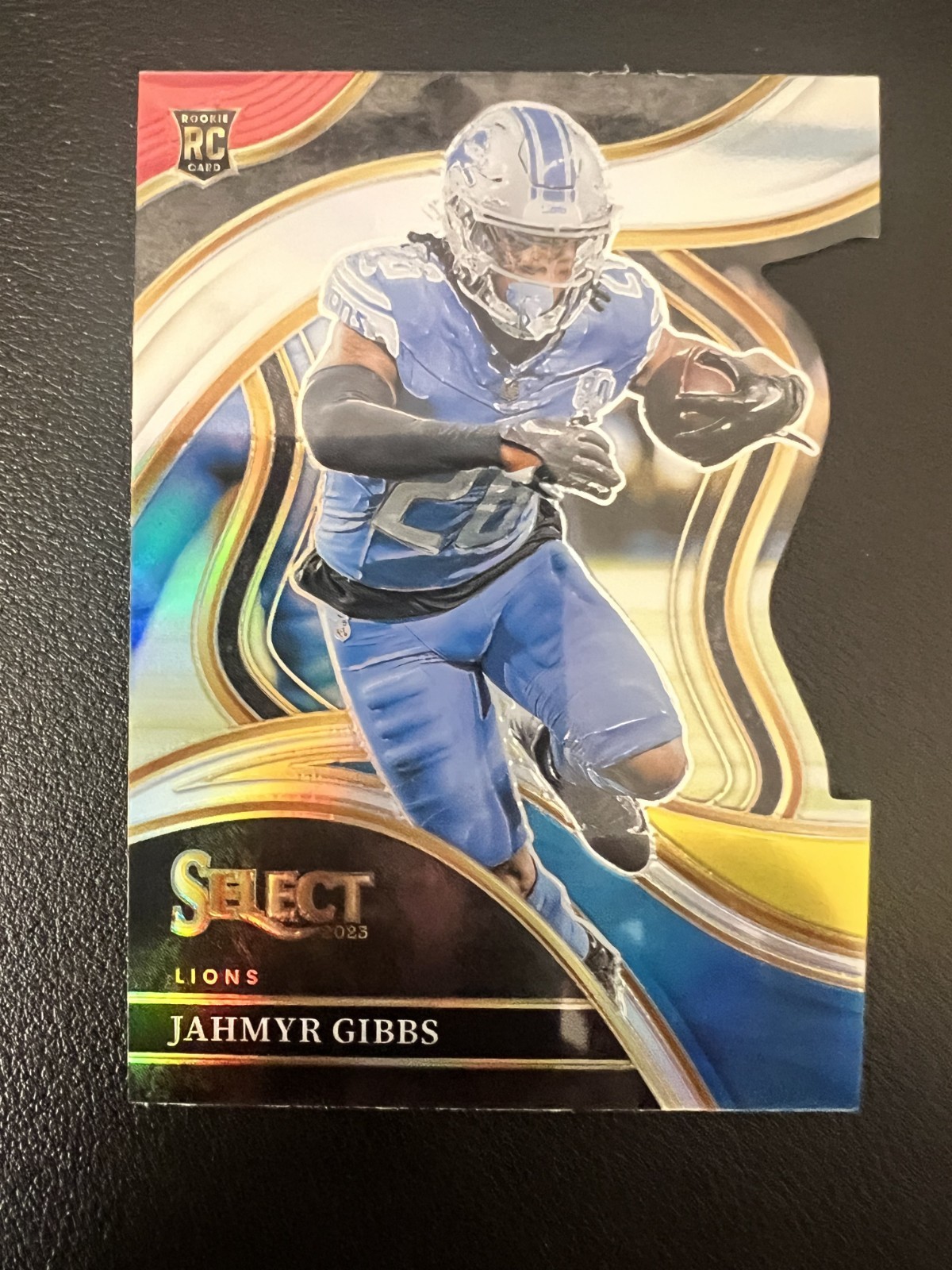 2023 Select Jahmyr Gibbs RC Red and Yellow Prizm Die Cut Club #266 Lions