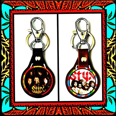 STYX THE GRAND ILLUSION LEATHER KEYCHAINS LOT OF TWO ( BLACK & BROWN )