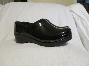 sanita black patent clogs