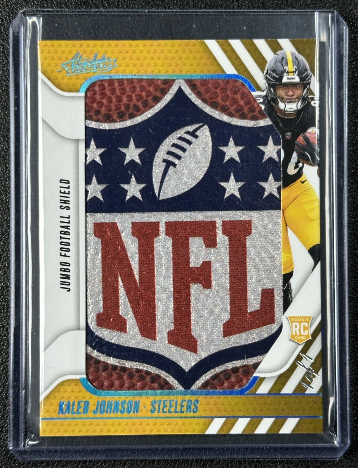 KALEB JOHNSON 2025 PANINI ABSOLUTE ROOKIE JUMBO SHIELD FOOTBALL BALL RELIC 1/1