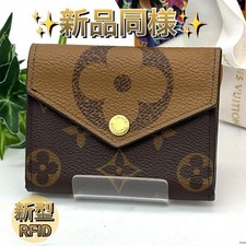 Louis Vuitton Monogram Giant Reverse Zoe tri fold wallet