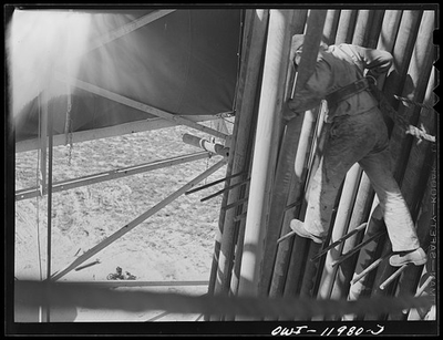 #ad Andrews County Texas 1942 Derrick Man Putting Drill Pipe in Place Oil Rig $13.49