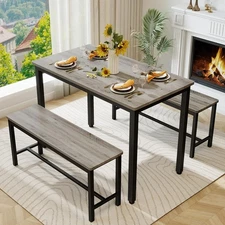 Durable and sturdy four-person dining table and chair set with bench. Grey.