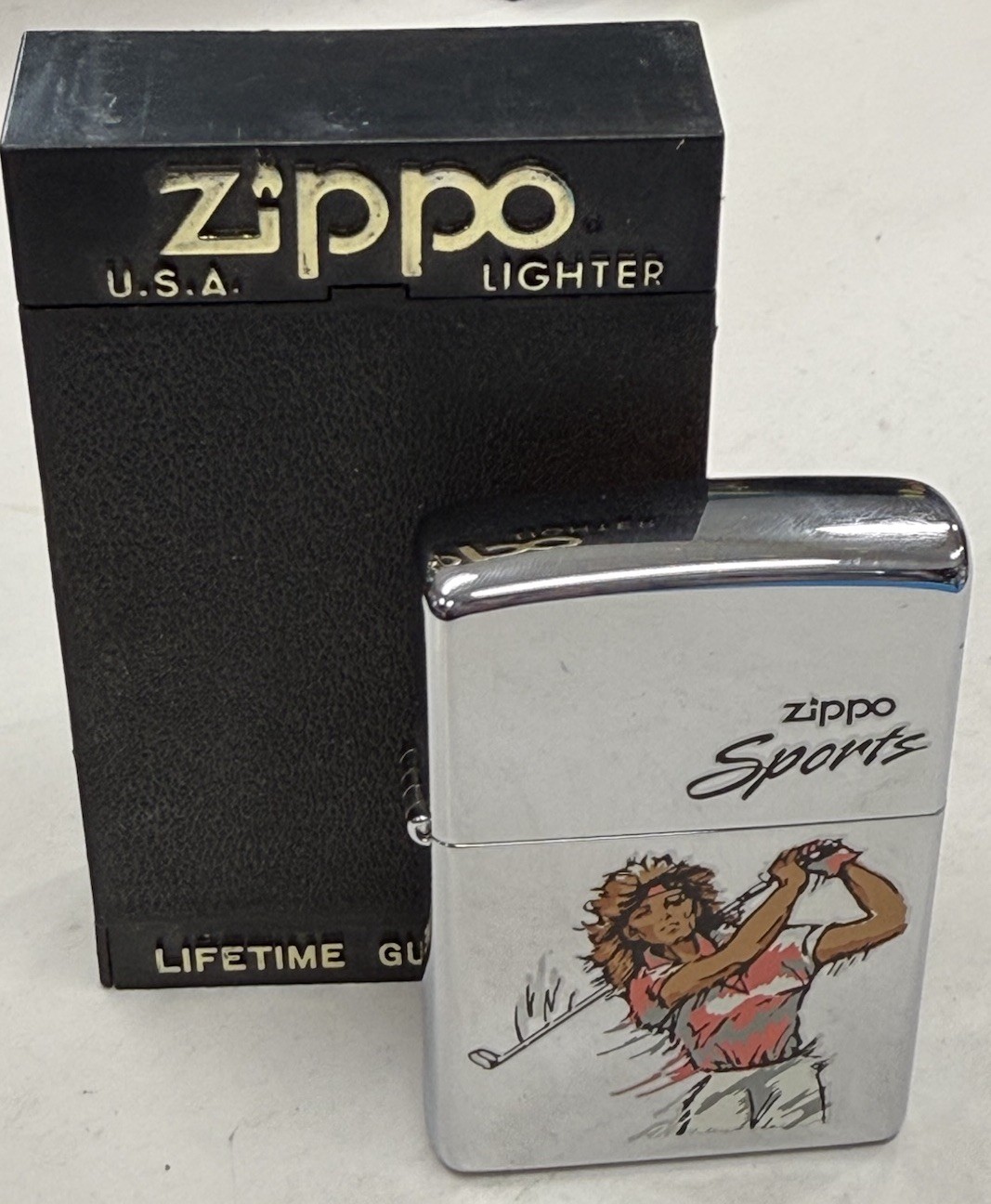 ZIPPO 2000 WOMAN PLAYING GOLF POLISHED CHROME LIGHTER SEALED IN BOX D67