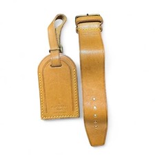 Authentic Louis Vuitton luggage tag and adjustable strap vachetta leather.
