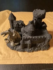 Mr Sandman castle sculpture with pewter dragon .