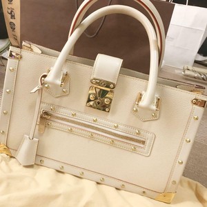 white and gold bag