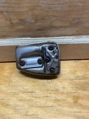 A used Muffler assembly from a Homelite Versa Tool trimmer power head