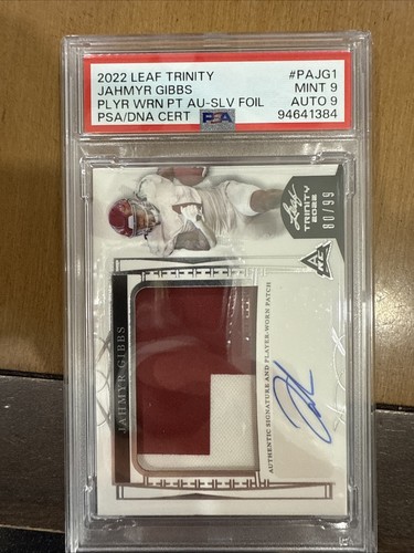 2022 Leaf Trinity - Patch Auto Jahmyr Gibbs #PA-JG1 Silver /99 (AU, MEM, RC)