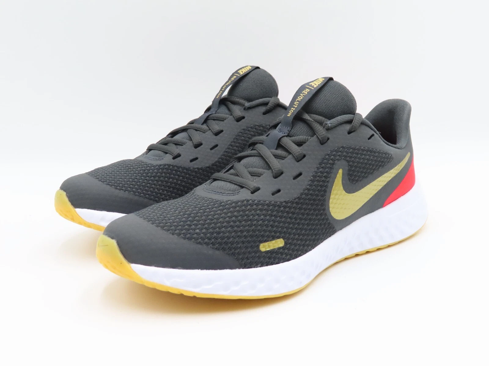 Scarpe da corsa Nike Revolution 5 giovani taglia 7 anni nero oro rosso BQ5671 016