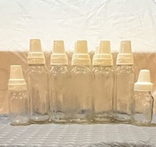 Set Of 7 Large  2 Small Vtg Evenflo Glass Baby Bottles W/ Plastic Rings  Lid