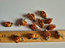 COPPER SATIN RIBBON ROSETTES ON GREEN  1 1/4 INCHES  12 PIECES