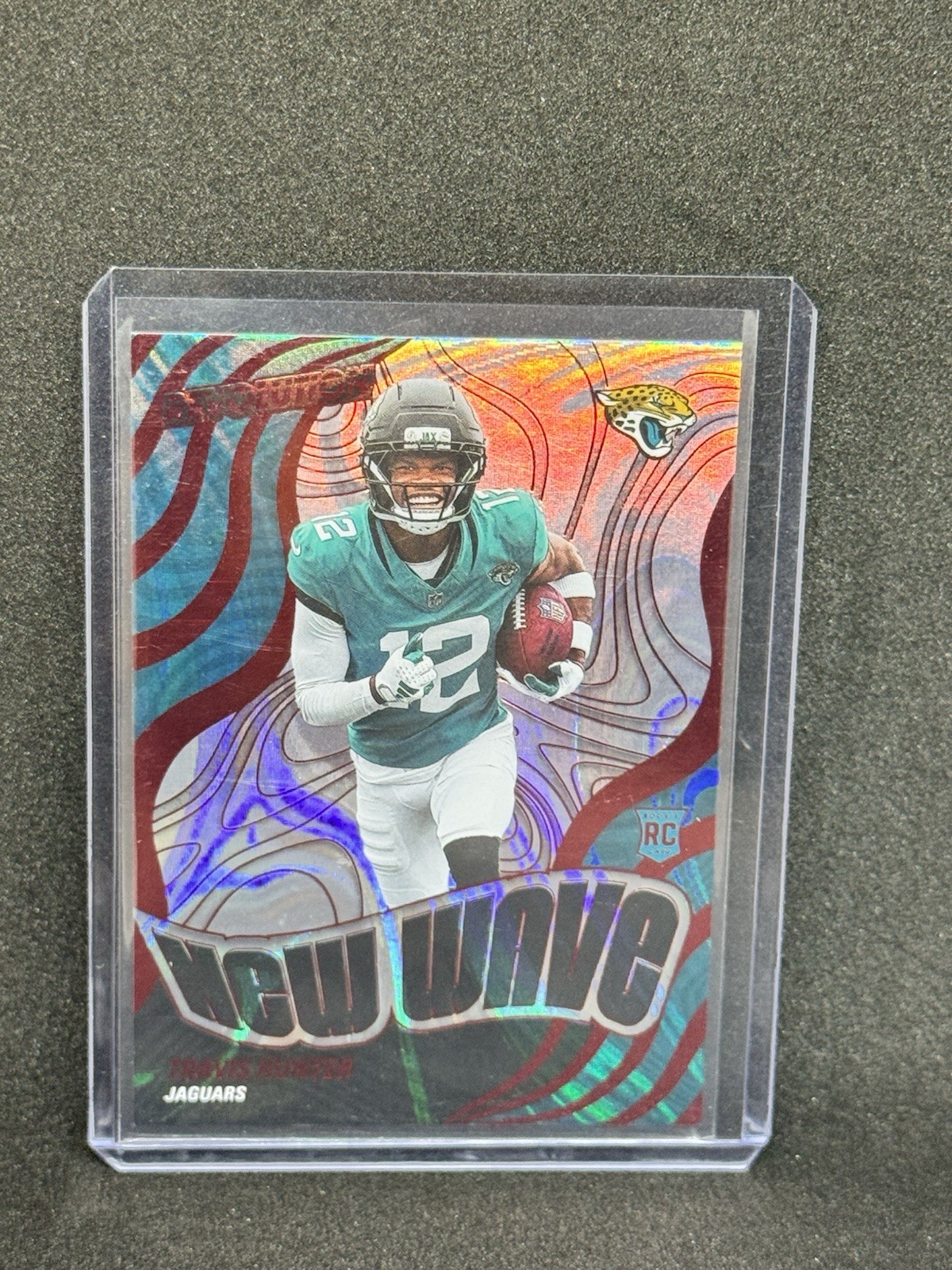 2025 Travis Hunter - Panini Revolution New Wave - Red Swirl - 23/50 - Jaguars RC