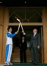 Sir Roger Bannister hands over the Olympic torch to Tim Henman dur- Old Photo