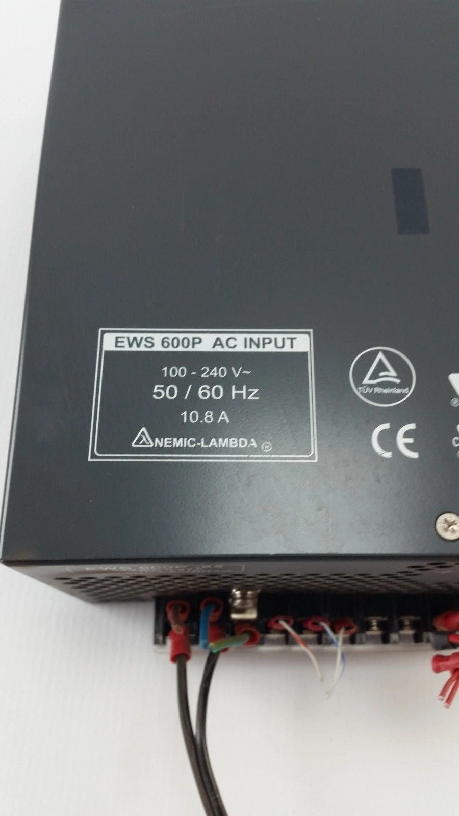 Nemic-Lambda EWS 600P AC input label: 100-240 V, 50/60 Hz, 10.8 A, TÜV Rheinland and CE marks