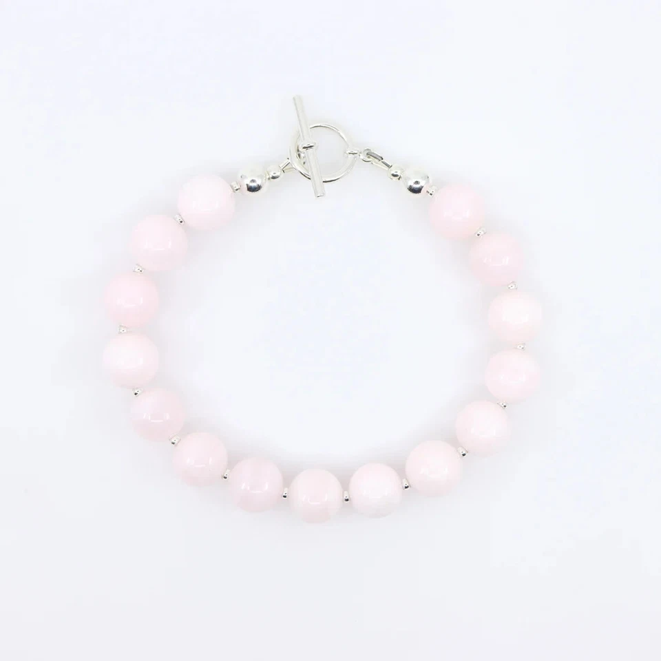 Brazalete de piedras preciosas de calcita rosa de 10 mm con cierre de palanca de plata de ley Foto 3 de 4