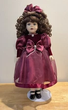 Decorative Porcelain Doll Brunette Curls Red Bow And Dress Brass Key Collectible