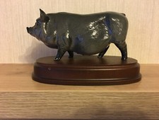Royal Doulton Vietnamese Pot Bellied Pig on a wooden plinth