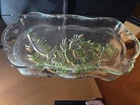 Vintage carnival glass bowl with a floral or grapevine design