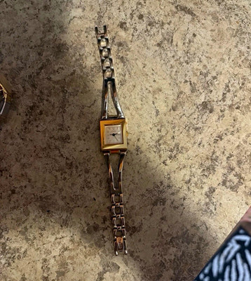 Vintage Guess women's bracelet watch with a rectangular case and a silver-tone