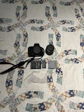 Cannon EOS Rebel T7 DSLR Camera with Battery, Bag, Lens Cover, and Strap + more