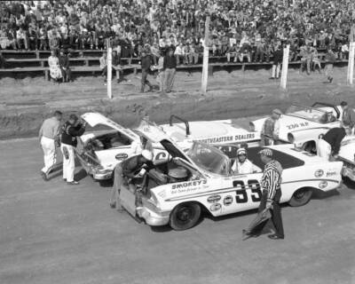 Paul Goldsmith checks flagman he prepares run No 33 Chevrolet NASC- Old Photo