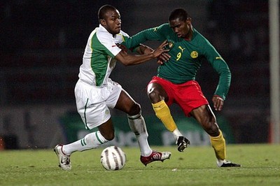 Samuel Eto'o of Cameroon is tackled by Omar Daf of Senegal at the- 2005 Photo