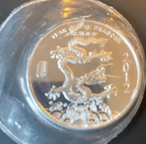 2012 Year of the Dragon 1 Troy Ounce .999 Fine Silver Round sealed in plastic