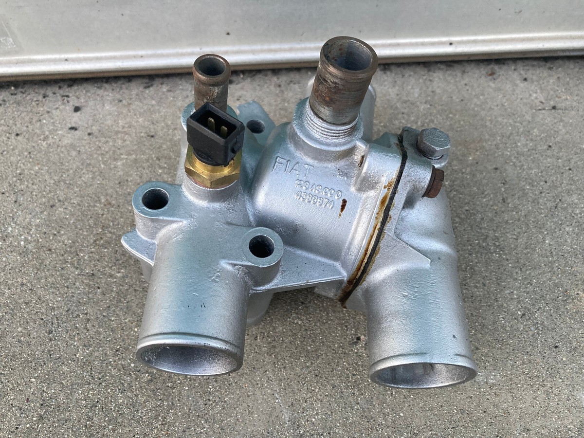 Used Thermostat Housing for 80-89 Fuel injected Fiat X1/9 Used Thermostat Housing for 80-89 Fuel injected Fiat X1/9