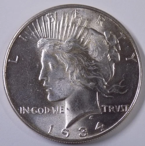 1934 $1 Peace Dollar Uncirculated, blazing luster, lightly cleaned