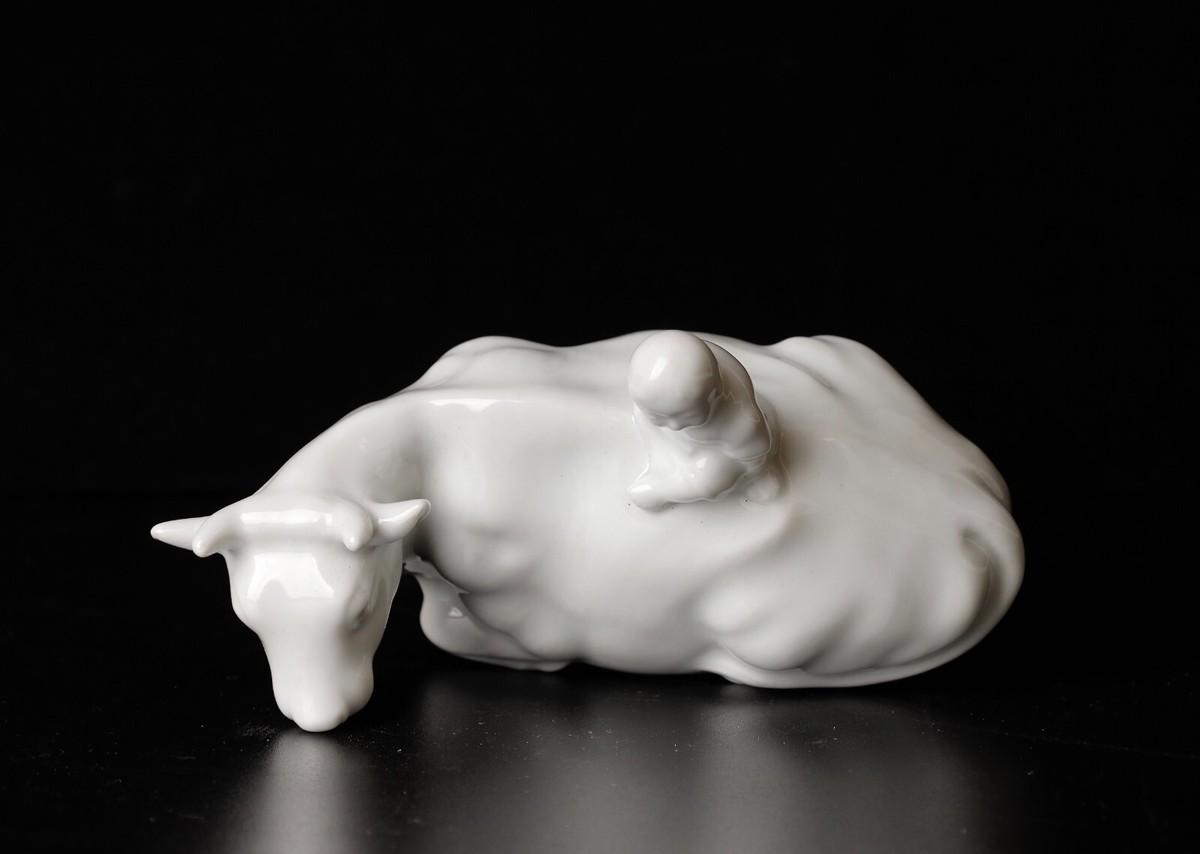Beautiful signed miniature Porcelain of Boy riding the Bull