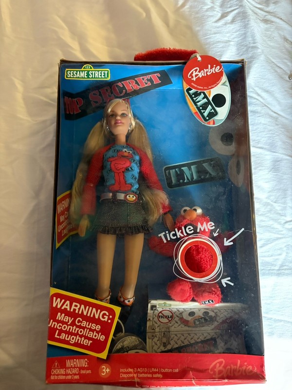 2006 original tickle me elmo barbie , slightly damaged package