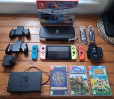 Nintendo Switch Gen 1 bundle x3 games + 64gb SD memory card installed.